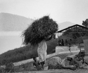 women carrying heavy headload