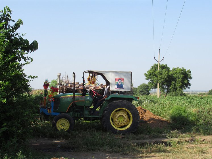A tractor parked near sugarcane field