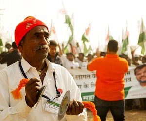 A farmer from Kolhapur district of Maharashtra playing cymbals to mark the begining of the march from Ramlila Maidan to Sansad Marg near Jantar Mantar.