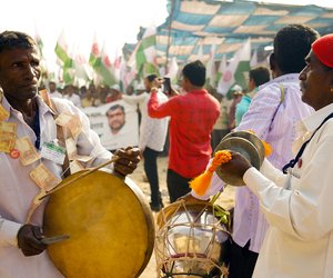 A drummer with farmers from the Swabhimani Shetkari Sanghatana of Maharashtra walks towards Parliament. 