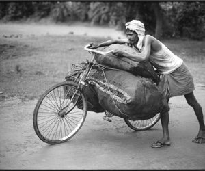 Side shot of coal carrier carrying coal on a modified cycle