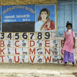 Girl standing in front of school