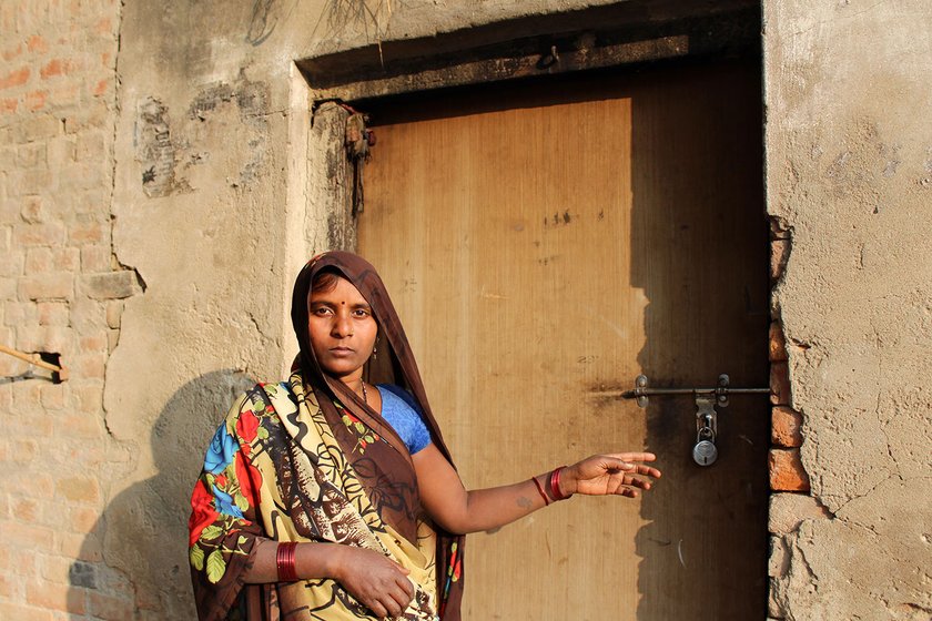 Bhootani Devi (Dharmendra’s sister-in-law) in front of the locked door of Dharmendra’s house in the village of Dharauta