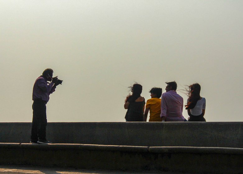 Baijnath Choudhary, who works at Narmian Point and Marine Drive, says: 'Today I see anyone and everyone doing photography. But I have sharpened my skills over years standing here every single day clicking photos'