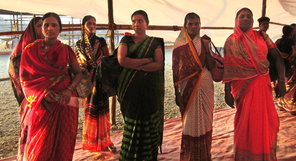 Women standing under empty canopy