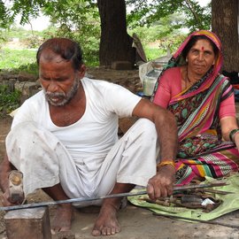 A blacksmith couple working