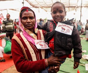 Mother and Child standing under the canopy at Ramleela maidan