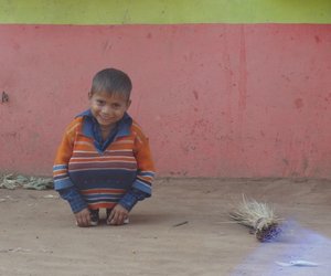 A child sitting and  smiling